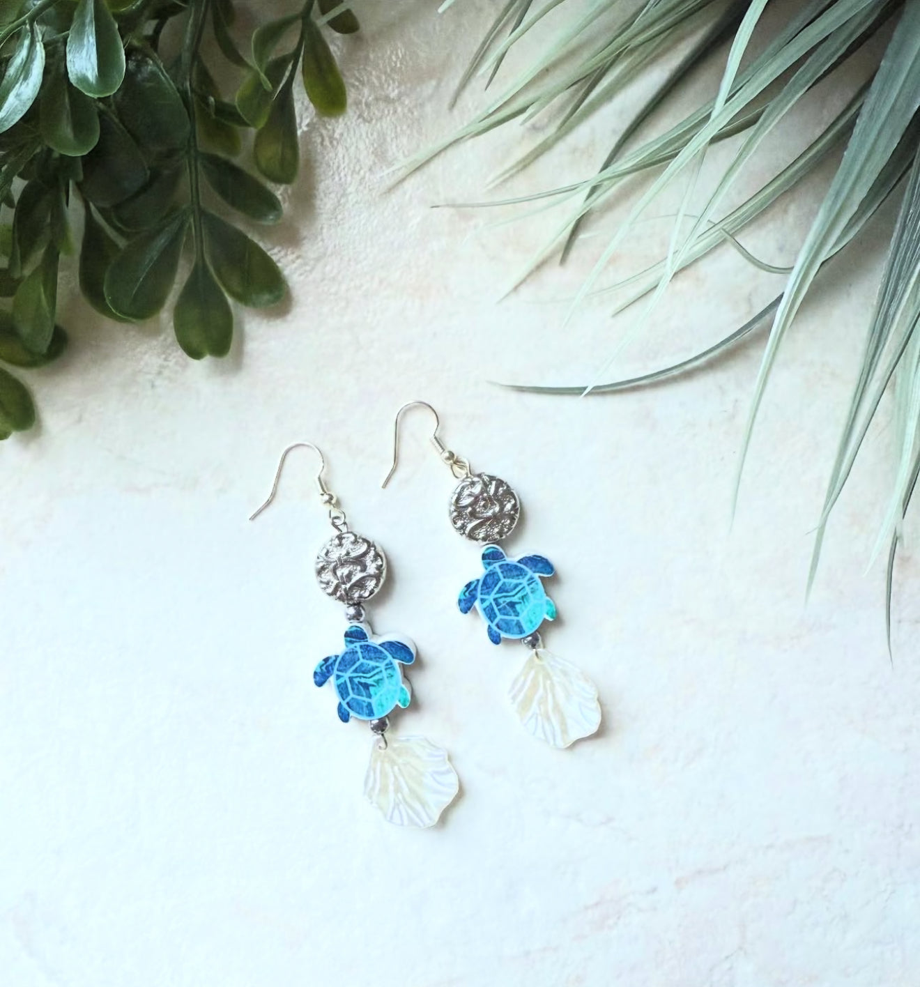Silvery beads and wood turtles with acrylic seashells